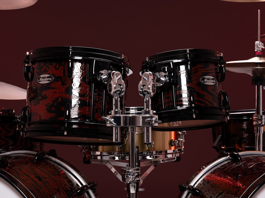 A close up of a drum set on a dark background