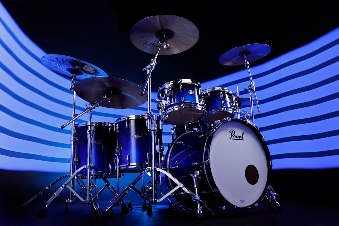A blue drum set sitting on top of a stage