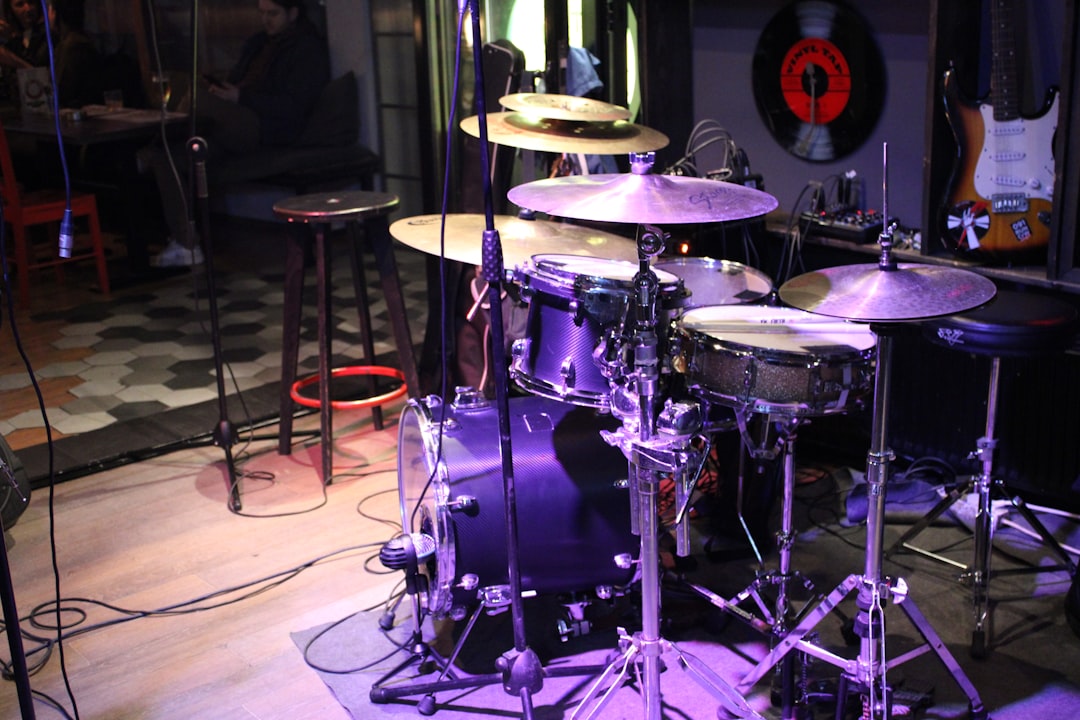 A drum set up in a recording studio