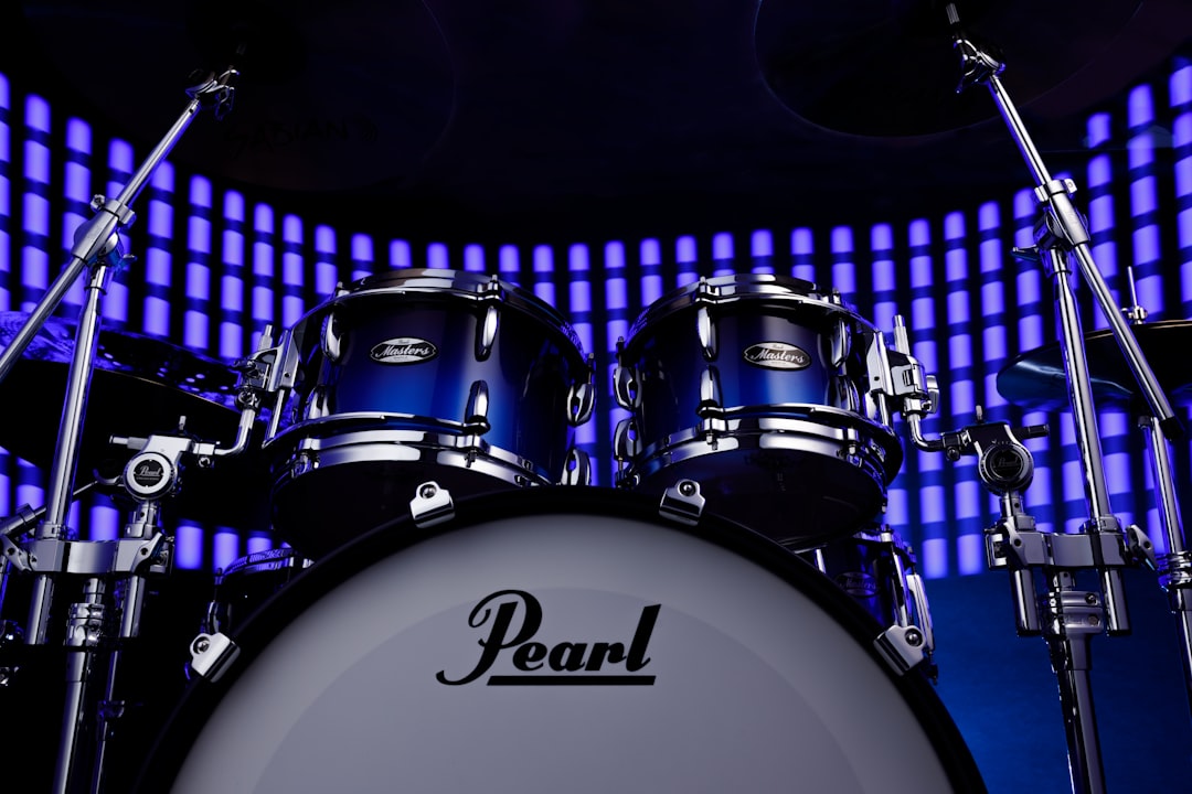 A blue drum set sitting on top of a stage