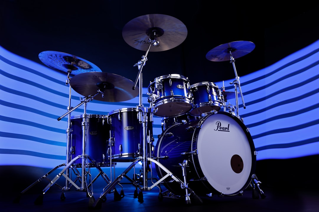 A blue drum set sitting on top of a stage